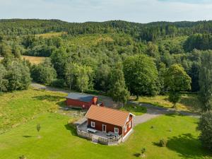 an aerial view of a house and a barn at Holiday Home Teåker by Interhome in Bäckefors