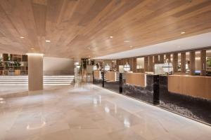 a lobby of a building with a wooden ceiling at Meliá Palma Marina in Palma de Mallorca