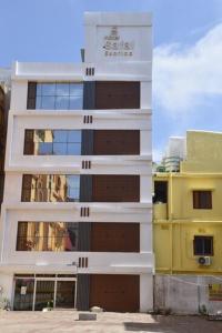 a tall building with a sign on the side of it at Hotel safal exotica in Puri