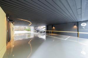 a parking lot with a car parked in a garage at Healasis in Seongnam
