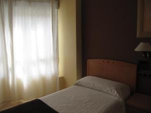Postel nebo postele na pokoji v ubytování Hostal Meseguer