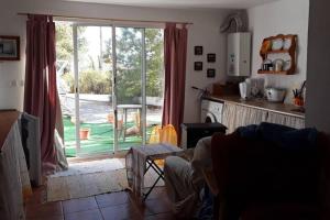 a kitchen with a sliding glass door to a yard at 2-Bed Apartment - Sleeps 3 - Parking - near Albox in Albox