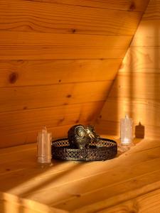 a group of candles and a engagement ring in a sauna at Komovi Luxury Sunset in Andrijevica +38 photos