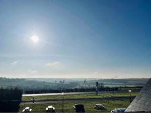 a view of a parking lot with the sun in the sky at Rutland Point in Uppingham