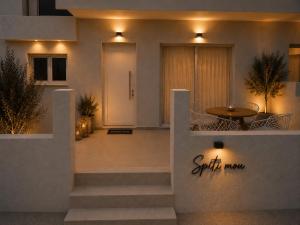 a house with a staircase leading to the front door at Spiti mou - 2bd House in Mastihari