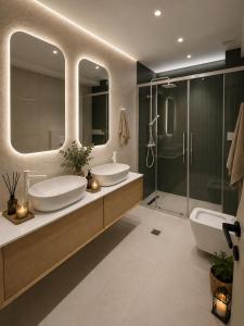 a bathroom with two sinks and a shower at Spiti mou - 2bd House in Mastihari