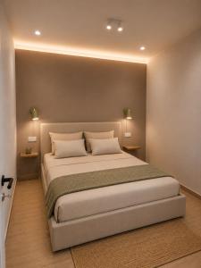 a bedroom with a large bed with two pillows at Spiti mou - 2bd House in Mastihari