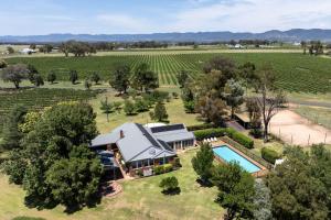 an aerial view of a farm house with a swimming pool at Eurunderee House in Eurunderee