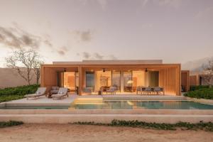 a house with a pool in front of it at Park Hyatt Cabo Del Sol in Cabo San Lucas