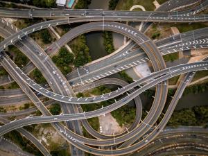 an overhead view of a highway with cars on it at Corneille City in Kinshasa