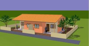 a model of a small house with a man standing outside at Corneille City in Kinshasa