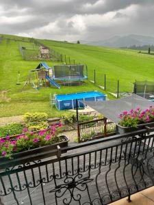 a view of a park with a playground at Chracowka in Małe Ciche