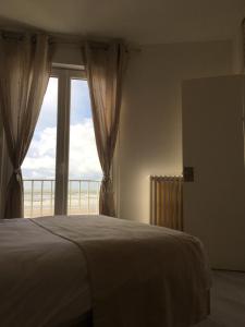 Кровать или кровати в номере Hotel La Terrasse