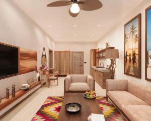 a living room with a couch and a table at Cocco Lagoon Resort & SPA 