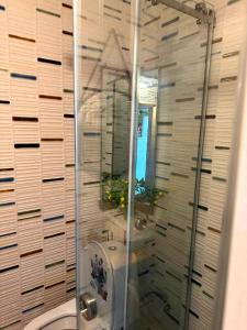a shower stall in a bathroom with a sink at Tbilisi Vake Inn in Tbilisi City +33 photos