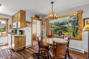 a kitchen and dining room with a table and chairs at Riverhouse in Clark