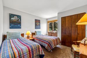 a bedroom with two beds and a window at Riverhouse in Clark +21 photos