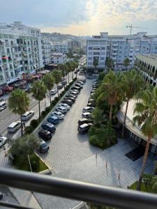 a group of cars parked in a parking lot at Almare ApartHotel in Golem