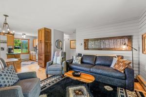 a living room with a couch and a table at Wintersong in Clark