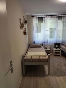 a bedroom with a bed in a room at My Way in Beograd