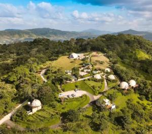 an aerial view of a farm with domes at Kintiri Glamping in Nicoya