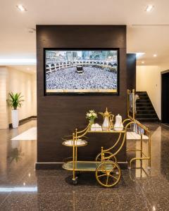 a hotel lobby with a television on a wall at توارن للشقق المخدومة اقتصادي in Al Khobar +18 photos