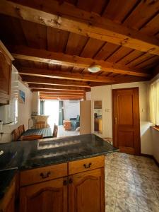a kitchen with a counter top in a room at Sziget Apartman Fonyód in Fonyód