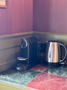 a coffee maker and a toaster on a counter at The Linen Rooms in Knutsford