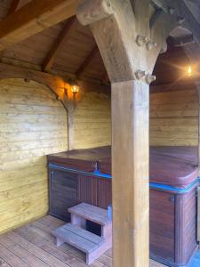 an inside view of a sauna with wooden walls at Cabana Magura Mare Belis in Călăţele +62 photos