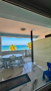 a dining room with a view of the ocean at Miramare in Crotone