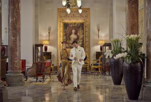 a man and a woman walking through a lobby at Hôtel du Palais Biarritz, in The Unbound Collection by Hyatt in Biarritz +158 photos