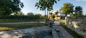 a stone path in front of a house at Dvalebi's Marani in Gori