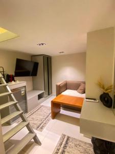 a small room with a bed and a desk at The Grand Elite Cairo Hotel in Cairo