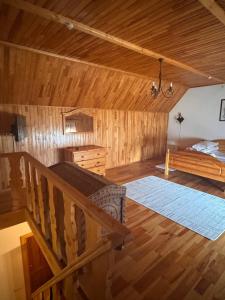a bedroom with a bed and a wooden ceiling at Плай in Khmelnytskyi