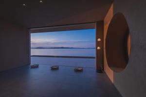 a view of a room with a view of the water at ENINARU East in Otsu