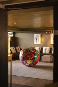 a large bowl sitting on the floor in a living room at Crans Ambassador in Crans-Montana
