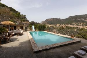 a swimming pool with a view of a mountain at Fabulous Rustic Villa Set On Mountain With Unique Views in Valldemossa