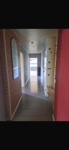 an empty room with a door and a hallway at Ferienwohnung Reckerche in Reckershausen