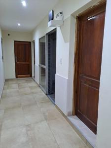 a hallway of a house with a door and a floor at ALOJAMIENTO NORTE 1 in Santiago del Estero