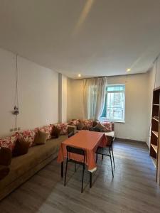 a living room with a couch and a table at Hotel Astoria Tanger in Tangier