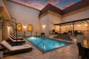 a swimming pool in a house at Holiday Inn Monclova by IHG in Monclova