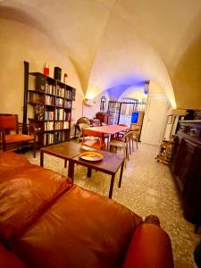 a living room with a couch and a table at Ca' Letizia in Noli
