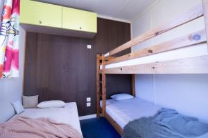 a bedroom with two bunk beds and a bed at Camping Pays Basque in Bidart +61 photos