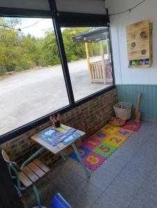 a view of a room with a table and a window at La Halte in Torigni-sur-Vire +7 photos