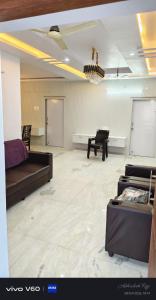 a living room with a couch and a piano at Graps Ocean Stay in Chīrāla