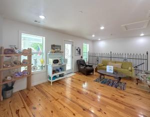 a living room with a couch and a table at Springs WishDowntown Historic Loop Downstairs King Free Parking in Eureka Springs