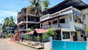 an apartment building on the side of a street at Sitara Homestay in Ratnagiri