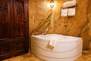 a bathroom with a toilet and a sink at la mar cave cappadocia in Ürgüp