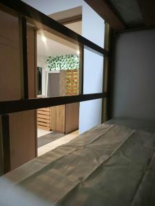 a close up of a bed in a room at Multiverse Hostel in Medellín