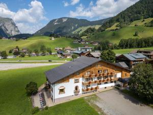 an aerial view of a village in the mountains at Hotel Elisabeth in Schoppernau